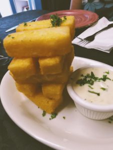 A Jenga-style stack of polenta fries with gorgonzola cream dip from Aglio e Olio.