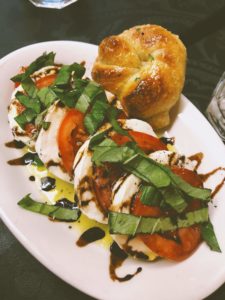 The caprese salad and garlic knots at Aglio e Olio restaurant in Seattle.